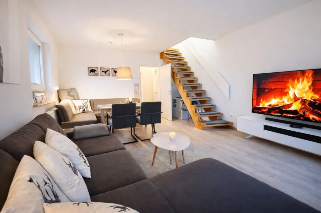 Titelbild Apartment Skiwiese in Braunlage im Harz mit moderner Ferienwohnung und hellem Wohnbereich